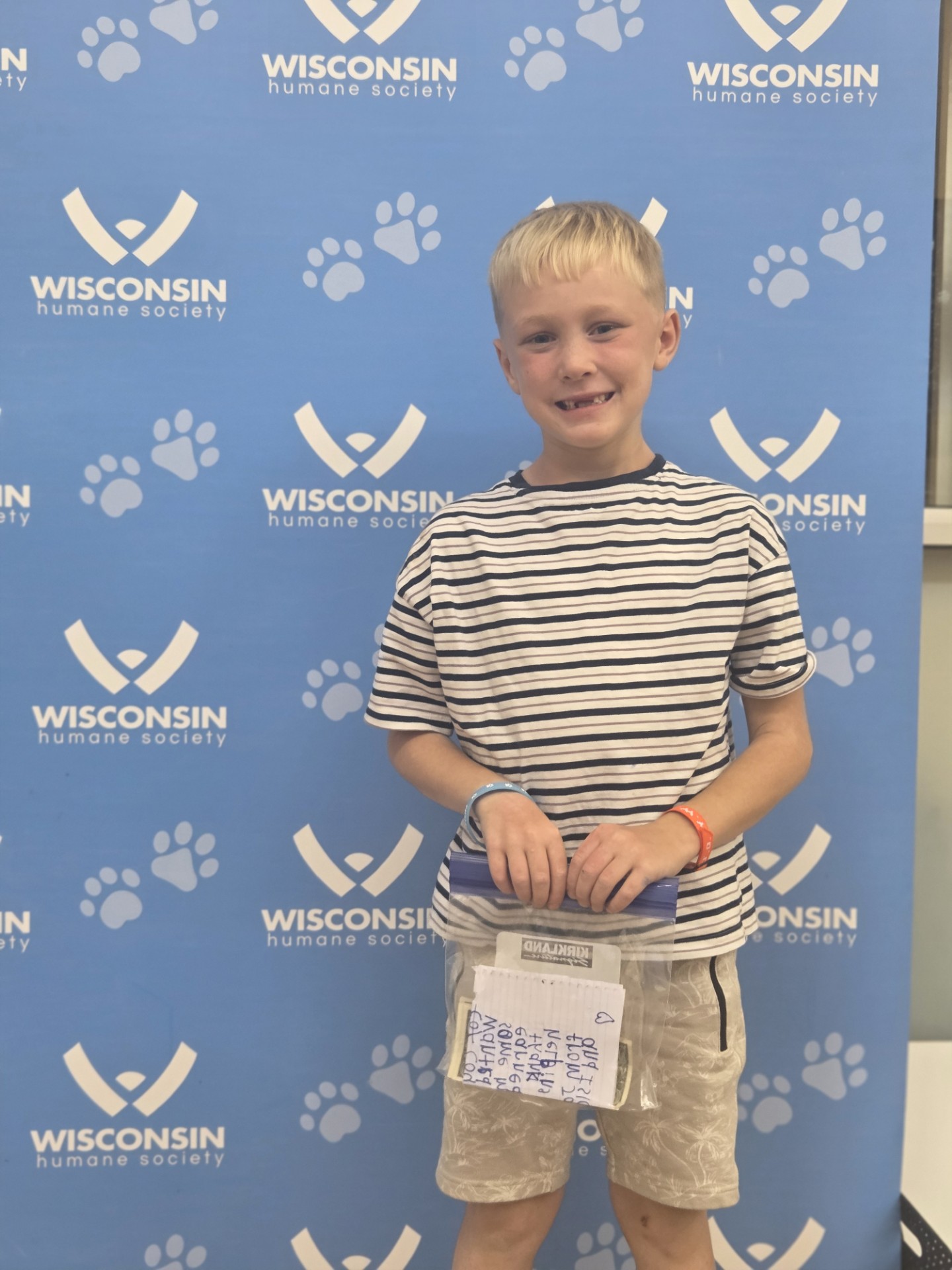 Boy holding donation